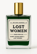 Lost Women fragrance bottle with deep green contents, an ivory label and a gold-tone cap.